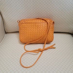 Orange Italian leather basket weave shoulder or cross body purse.